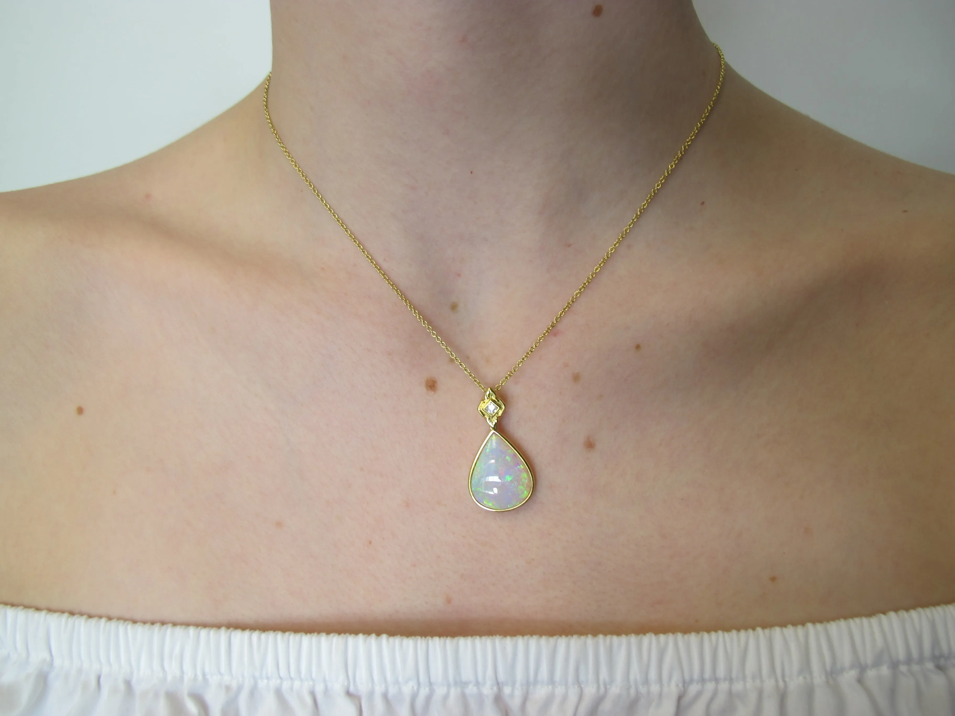 6.83 ct. Pear Shape Opal and Diamond Yellow Gold Bezel Set Drop Pendant