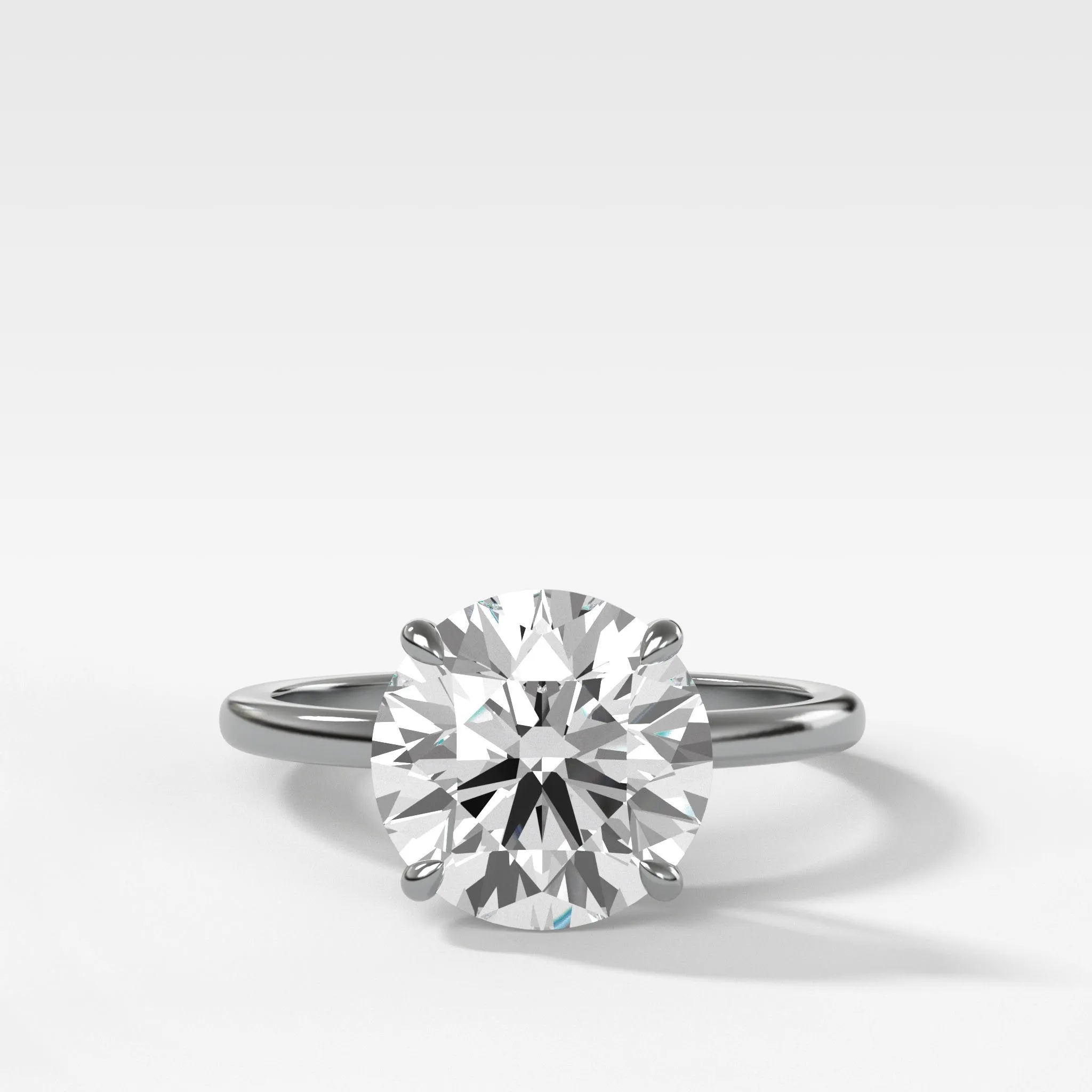 Crescent Solitaire Engagement Ring With Round Cut Diamond