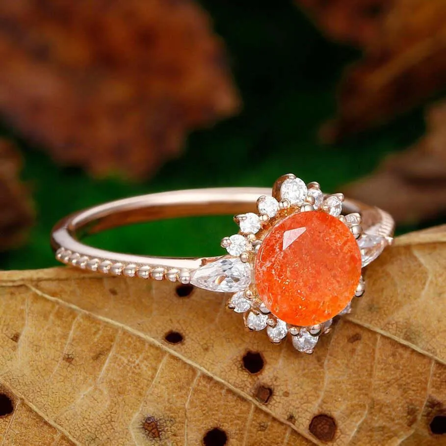 dainty 1.25ct round cut orange sunstone  nature inspired sunstone rose gold sunburst halo  Ring