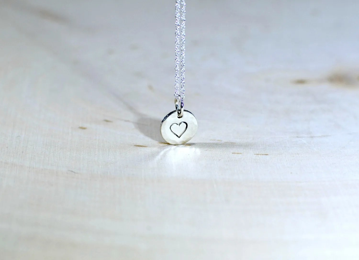 Sterling Silver Disc with a Heart Theme