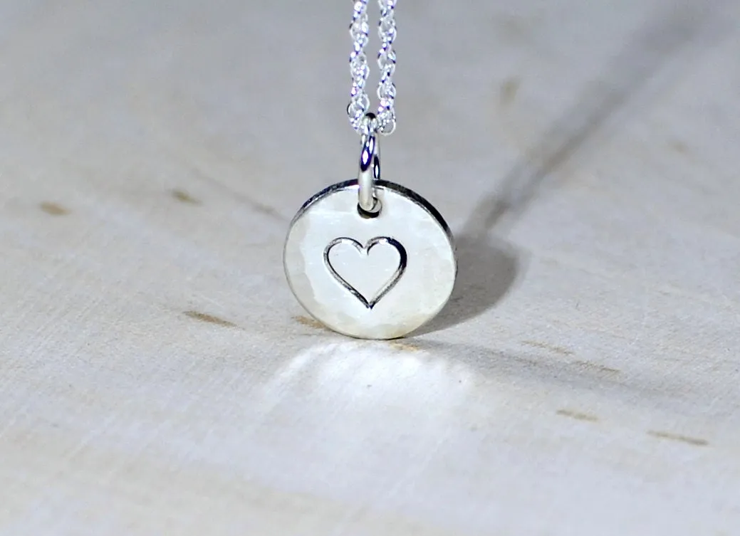 Sterling Silver Disc with a Heart Theme