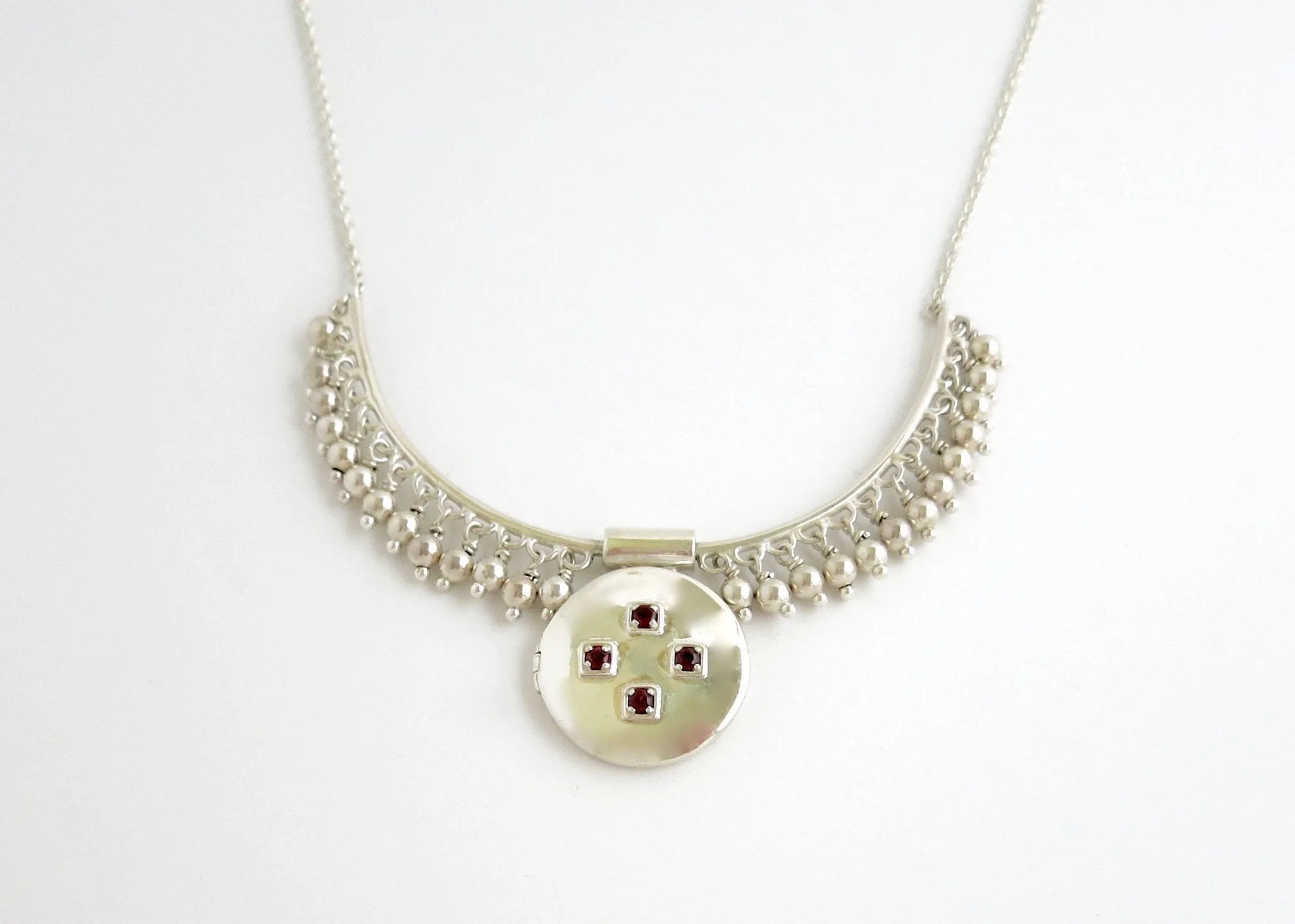 Vintage inspired, unique locket necklace in sterling silver and garnet