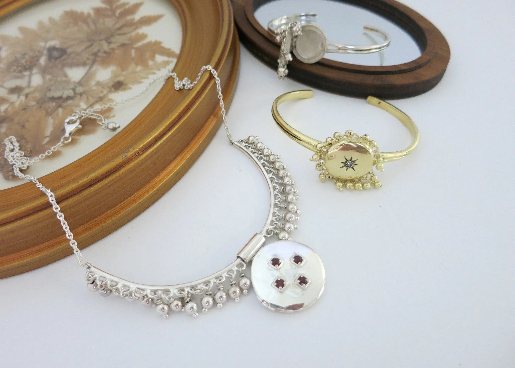Vintage inspired, unique locket necklace in sterling silver and garnet